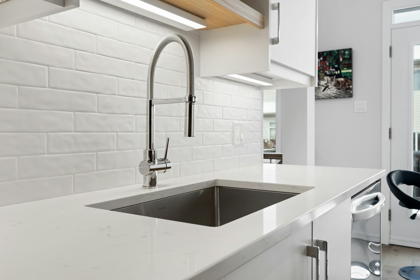 A bright kitchen with a sink and modern fixtures